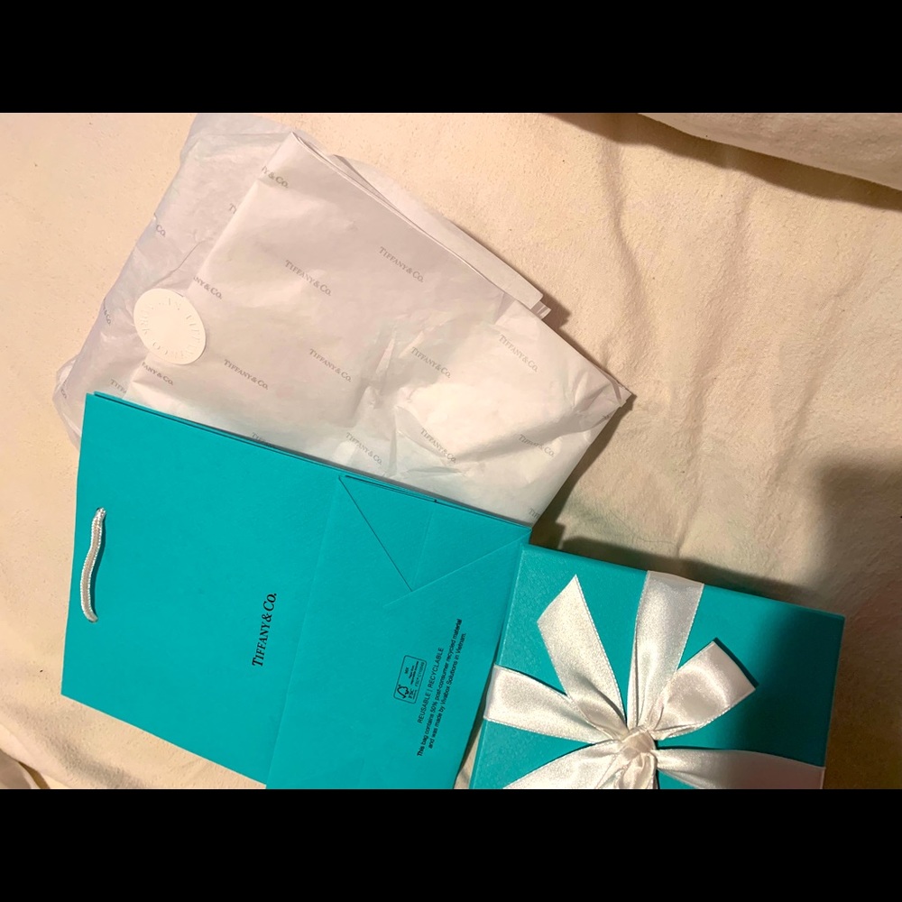 Brand new Tiffany bag, booklet, wrapping paper.